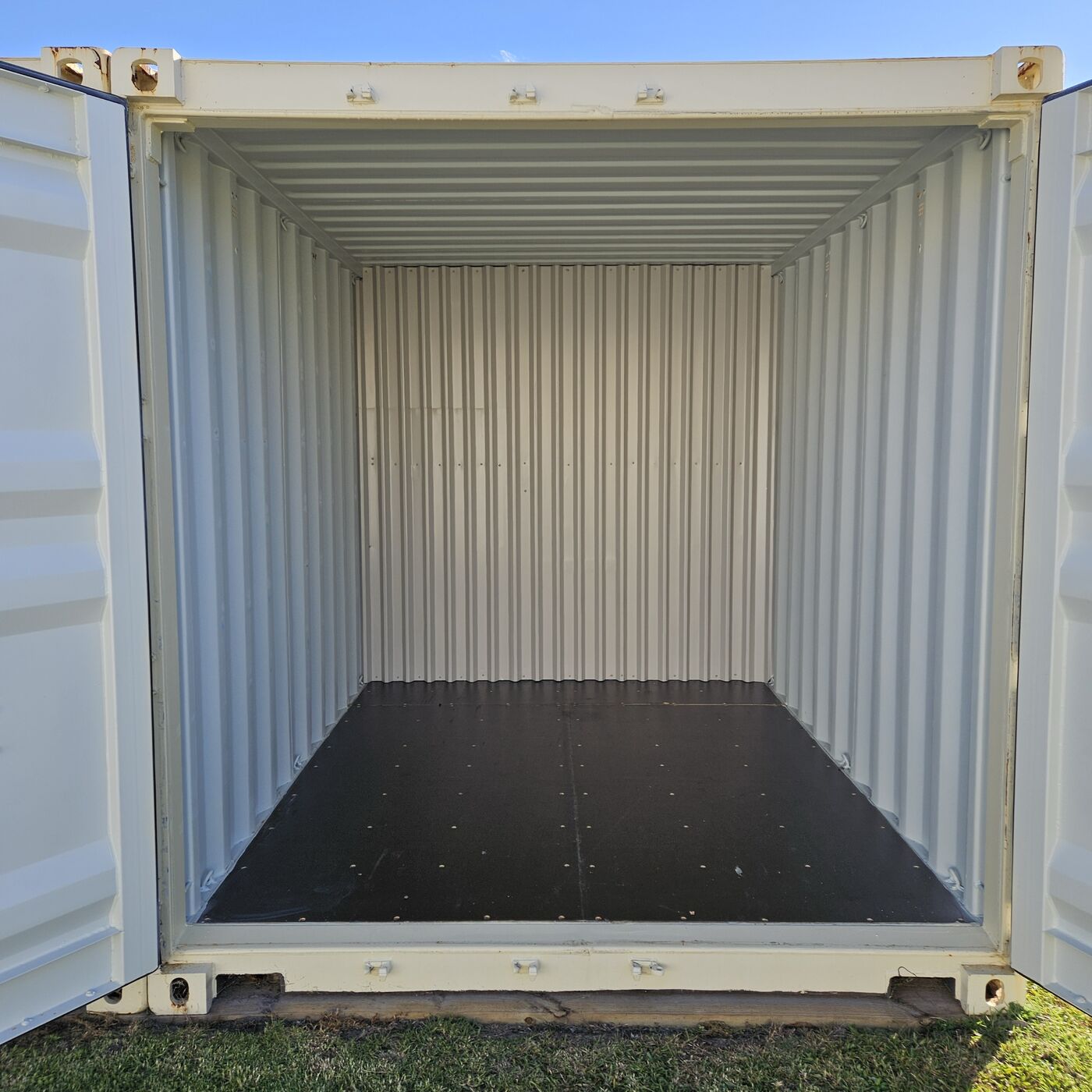 Inside a clean, empty half container with the doors open