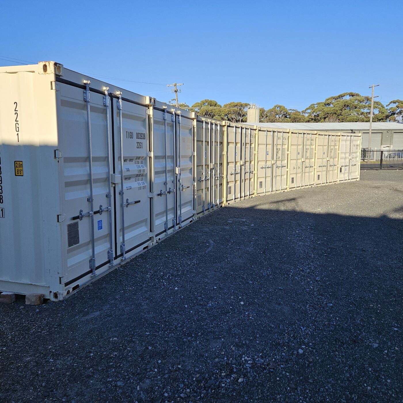 Row of containers on the gravel yard at Bermagui
